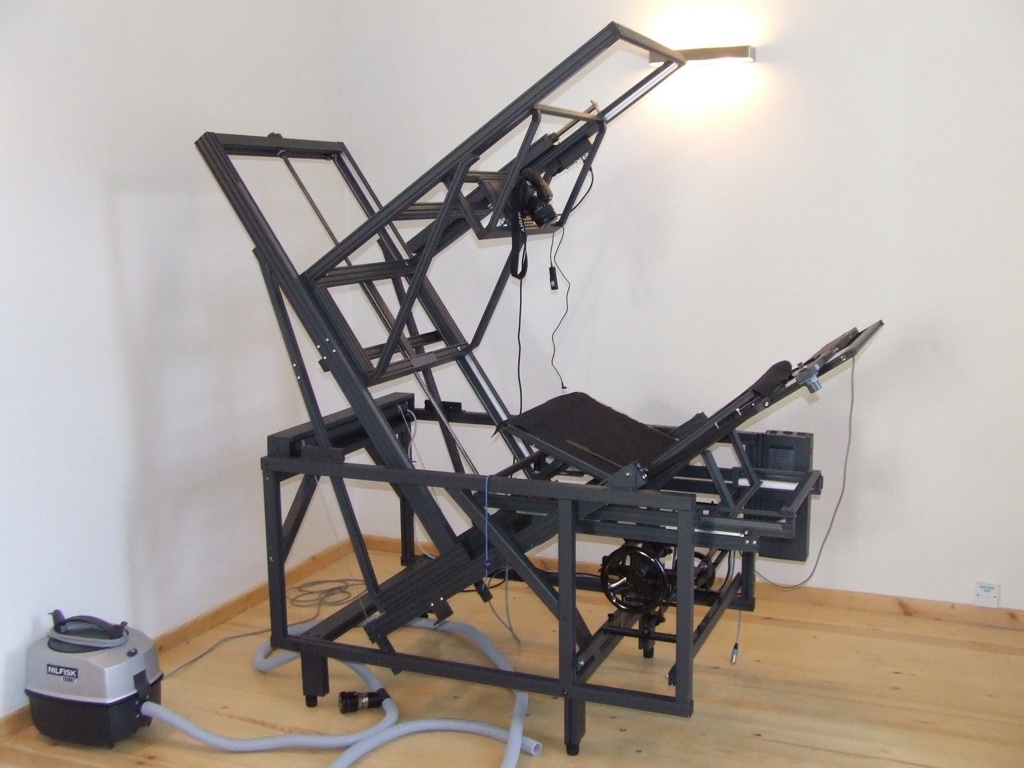 Conservation copystand designed to hold old manuscripts for photography.