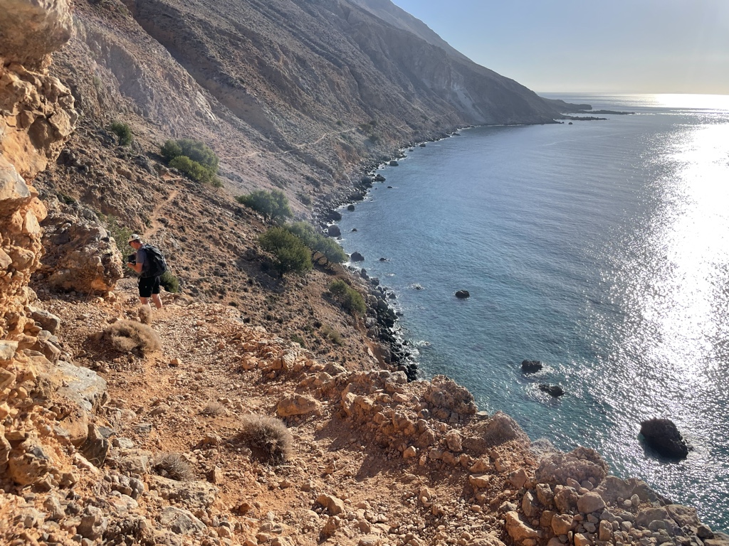 The trail follows the cliffside.
