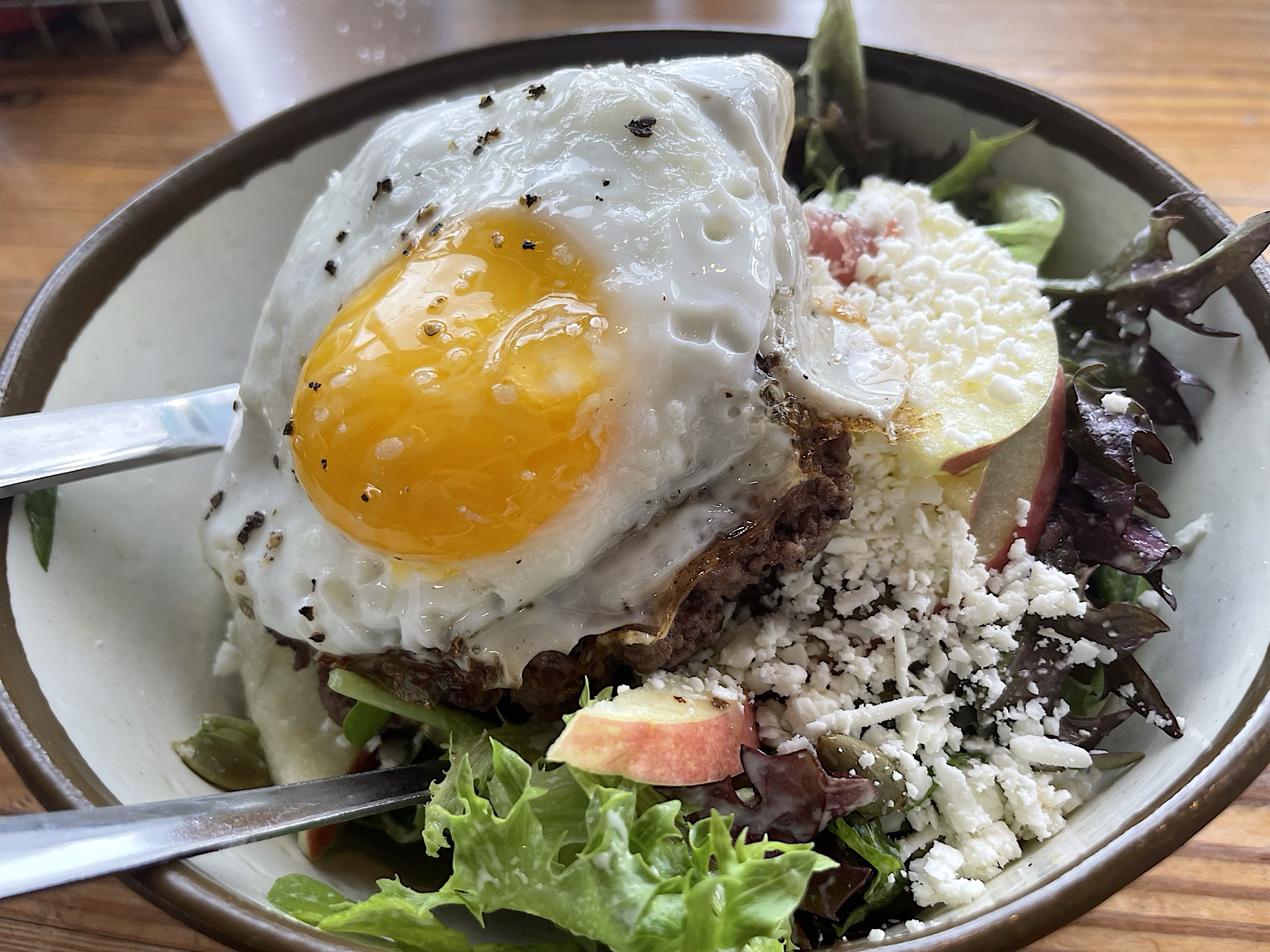 Farmburger on salad with egg on top–recommended!