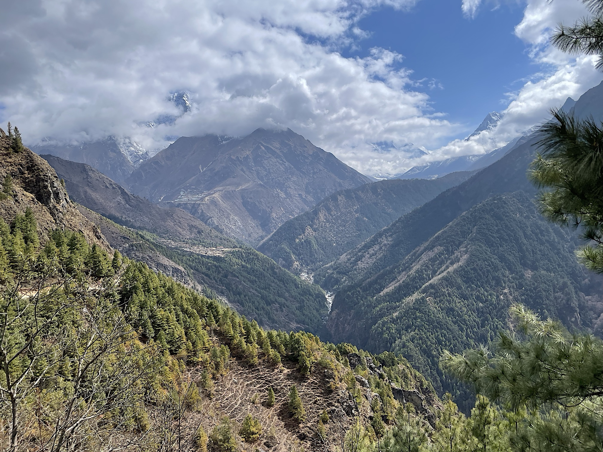 A view of the future: we could see the place we ate lunch in the foreground, the town of Phortse on the shelf beyond the valley, and Tengboche situated on top of the ridge to the right. Deboche and Pangboche are beyond it to the right.
