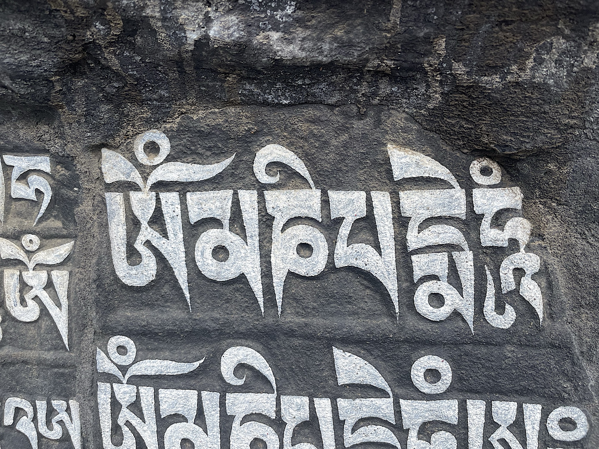 We passed numerous giant stones carved with Buddhist mantras. This one says “Om mane padme hum.”