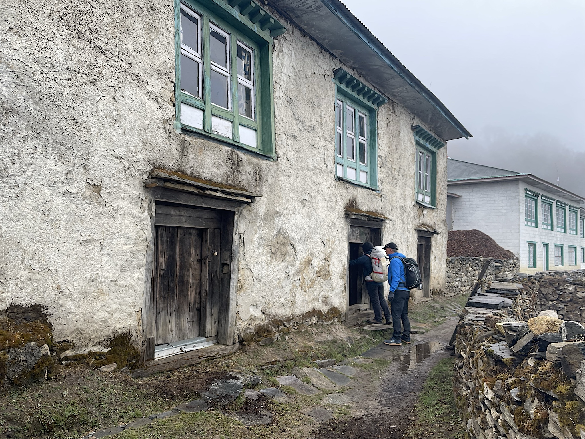 Chris and Bala check out an old house in Phortse. Livestock can stay in the bottom to help heat the top.